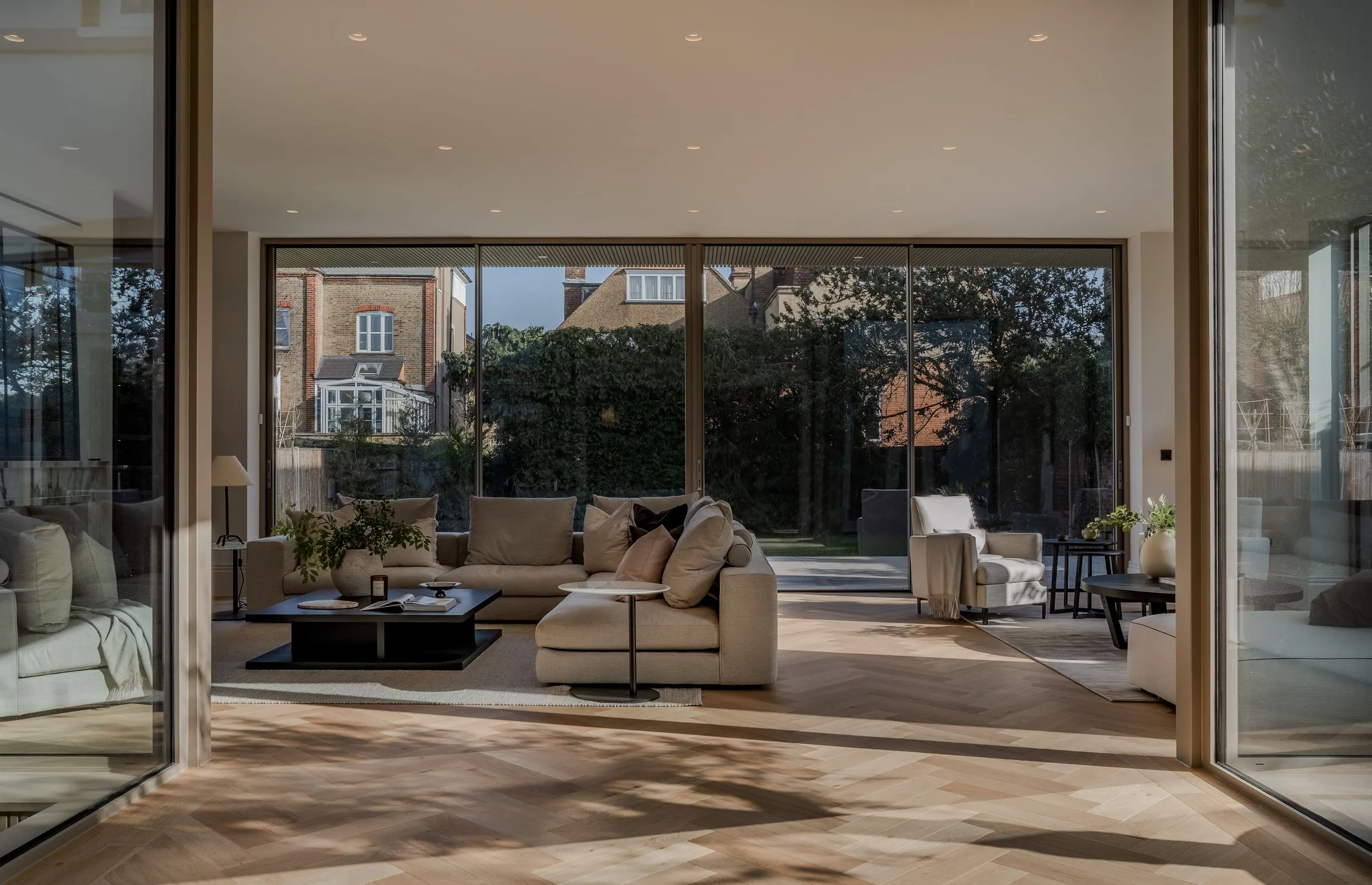 Living room with full-height sliding doors to the garden