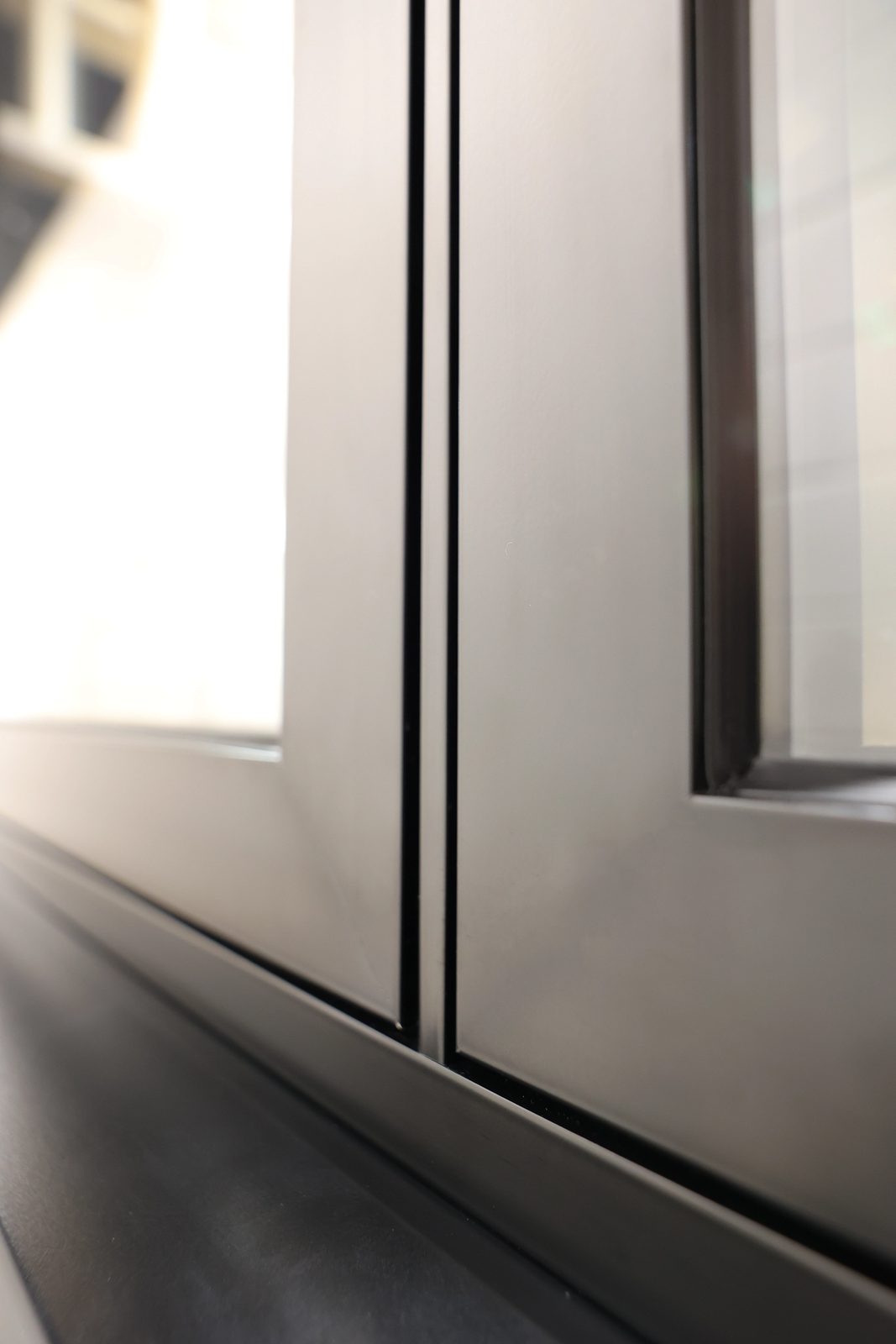 Close-up of a flush aluminium sash sitting level with its frame